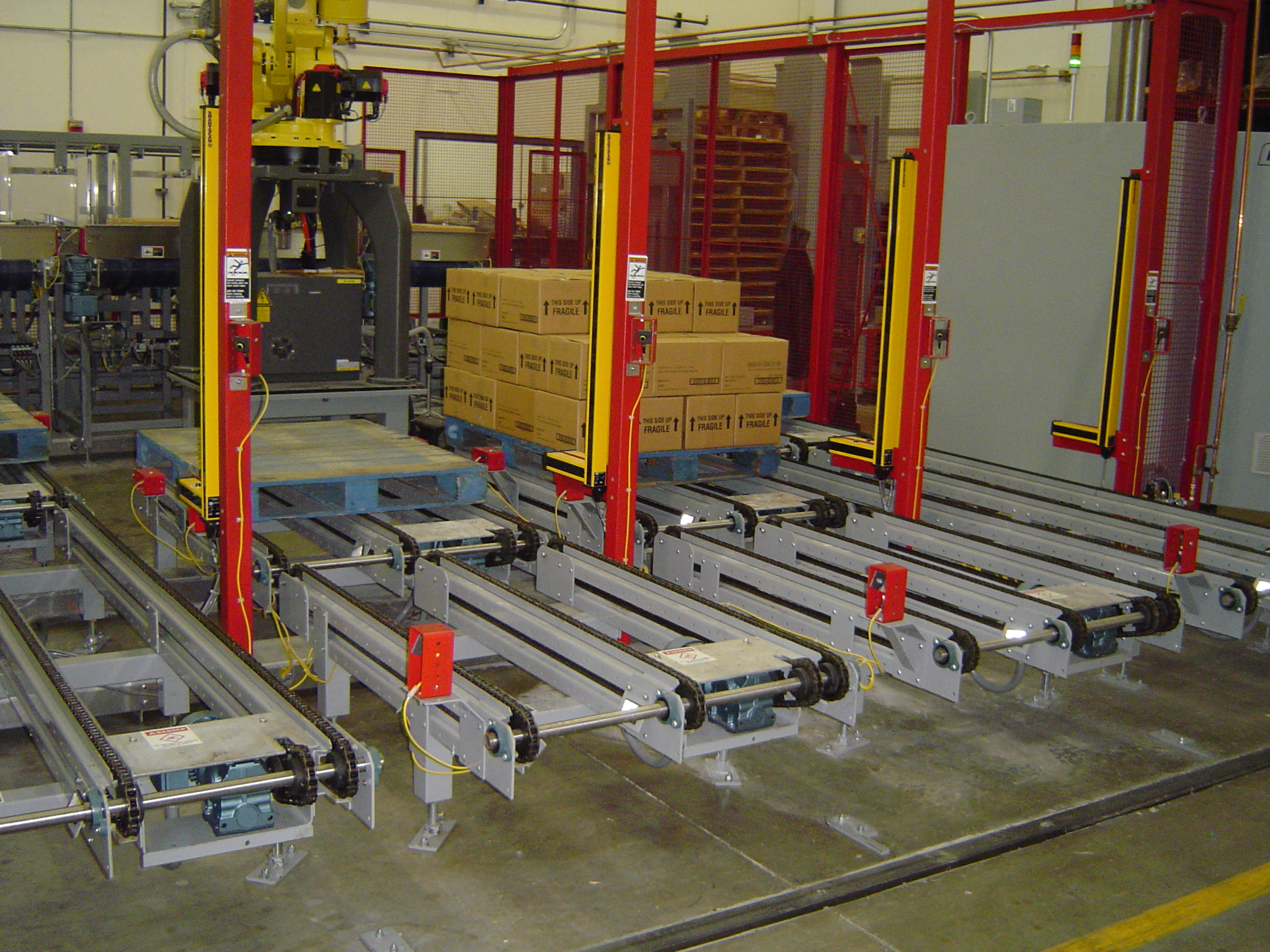 Robotic Palletizer and Discharge Conveyors Robotic Palletizer and Discharge Conveyors